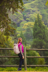 Fototapeta premium Girl hiking in the forest. Healthy lifestyle and activity.