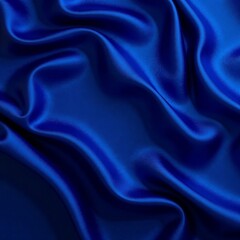 Obraz premium Luxurious blue satin fabric draping elegantly, showcasing rich texture and color.