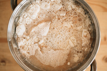water with flour, preparing bread dough