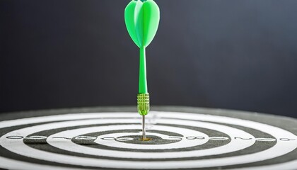 Bullseye Precision, Green dart perfectly hits center of a white target, symbolizing accuracy and success 
