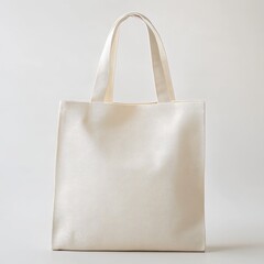 Plain white canvas tote bag isolated on white background.