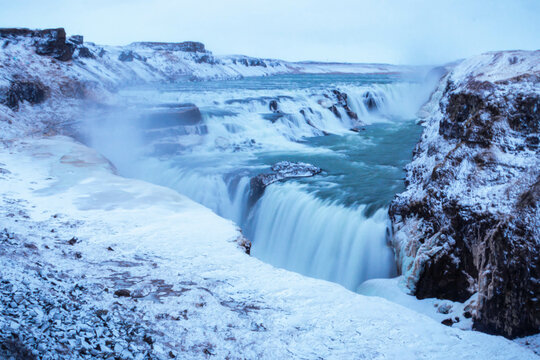 Iceland waterfall in the snow - Powered by Adobe