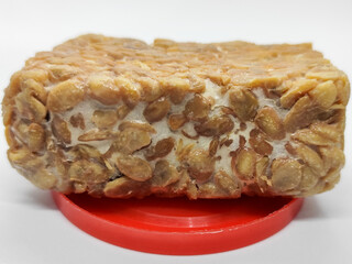 Soybean tempeh. Tempeh is a typical Indonesian food made from fermented soybeans mixed with yeast.