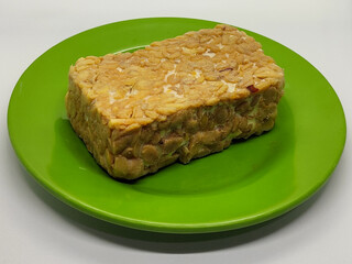 Soybean tempeh. Tempeh is a typical Indonesian food made from fermented soybeans mixed with yeast.