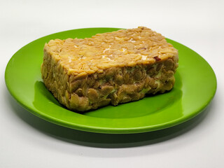 Soybean tempeh. Tempeh is a typical Indonesian food made from fermented soybeans mixed with yeast.