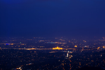 Budapest at night in yellow lights, aerial view, copy space. High quality photo