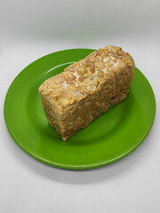 Soybean tempeh. Tempeh is a typical Indonesian food made from fermented soybeans mixed with yeast.