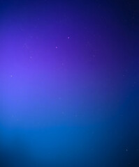 Captivating night sky transitions from deep blue to vibrant purple under a multitude of shimmering stars