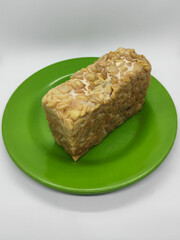 Soybean tempeh. Tempeh is a typical Indonesian food made from fermented soybeans mixed with yeast.
