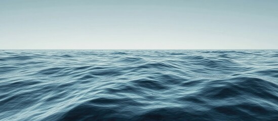 Tranquil ocean surface with gentle waves in shades of blue and serene glacial ridge background, ideal for text overlay or minimalistic design.