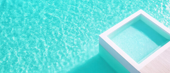 Fototapeta premium Aerial view of luxury infinity pool with turquoise water, creating serene and tranquil atmosphere. clear water reflects sunlight beautifully, enhancing relaxing vibe