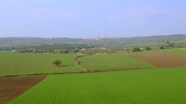 Winter panoramic view in Israel of green fields, mountains and villages