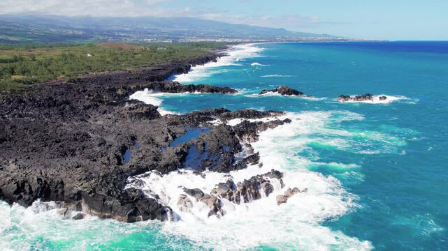 Aerial view on the chasm at Etang-Sal&eacute; in the south of Reunion island, with a turquoise sea and its corals