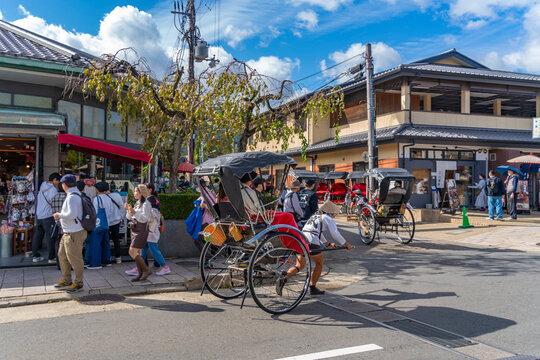 View of rickshaws near Togetsukyo Bridge over Katsura River, Sagatenryuji Susukinobabacho, Ukyo Ward, Kyoto, Honshu, Japan