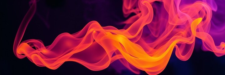 Obraz premium Abstract colorful smoke in vibrant shades of orange and pink against a dark background 