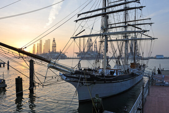 Tall ship Elissa, 1877, three-masted barque moored in port of Galveston at sunset, Galveston island, Gulf of Mexico, Texas, United States of America