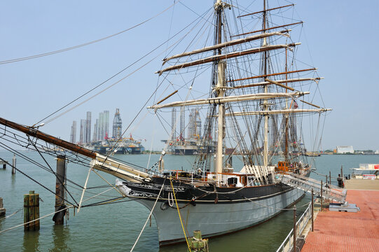 Tall ship Elissa, 1877, three-masted barque moored in port of Galveston at sunset, Galveston island, Gulf of Mexico, Texas, United States of America