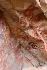 Vertical Image of Rock ledge on Rio Pinturas where famous rock paintings of handprints and animals are located. Location: Cueva de las Manos, UNESCO World Heritage Site, Patagonia, Argentina