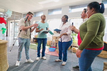 Employees standing and talking in crafts shop with wicker furniture
