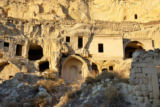 Part of cliff dwelling complex of ancient Christian churches and houses in village of Cavusin near Goreme, Cappadocia, Turkey