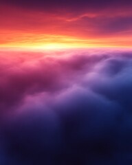 Vibrant sunset over a sea of clouds.