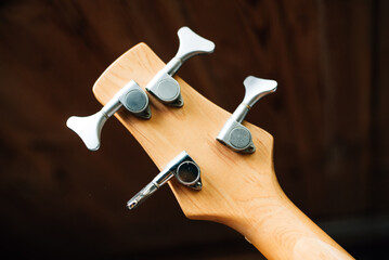 guitar tuning pegs on a dark background