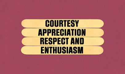 CARE Symbol. Concept word Courtesy Appreciation Respect and Enthusiasm on beautiful wooden stick. Beautiful Pink Chart Paper Background. Business and CARE concept. Copy space