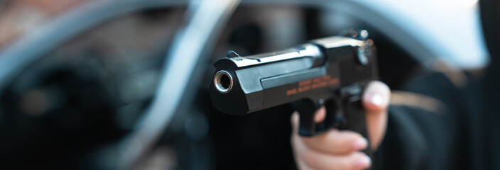 Female gangster, gun in hand, threatening, criminal