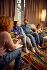 Parenting issues, education. Family of three, parents and their young girl, visiting psychologist,...