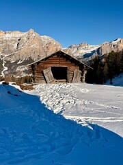 Italian Dolomites drone aerial view in winter snow ski sunny days. Sella Ronda Marmolada .Aerial landscape of snowy Italian Alps Dolomites with Sella group in front and Marmolada. Sella Ronda group.