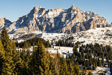 Italian Dolomites drone aerial view in winter snow ski sunny days. Sella Ronda Marmolada .Aerial landscape of snowy Italian Alps Dolomites with Sella group in front and Marmolada. Sella Ronda group.