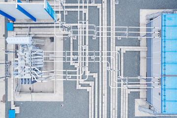 Obraz premium Aerial top view High voltage circuit breaker in power substation, ceramic insulator