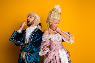 Elegant couple dressed in vintage royal costumes embodying the styles of historical aristocracy