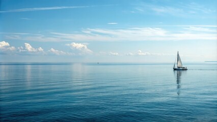 Calm blue sea surface with sailboat sailing in the distance, blue waves, sailboat, gentle