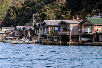 Naklejka premium Row of Traditional Boat Houses Along Ine Bay, Kyoto, Japan