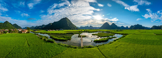 Aerial drone view panorama of Bac Son rice field valley at sunset, Lang Son, Vietnam