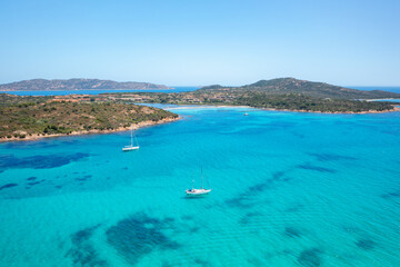 Drone aerial view of Salina Bamba beach with white sand and turquoise water in Sardinia, Italy