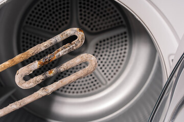 Close-Up of a Corroded Heating Element Inside a Dryer with Visible Limescale Deposits