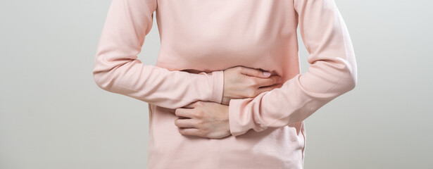 Flatulence asian young woman intolerance hand in stomach ache, suffer from food poisoning,...