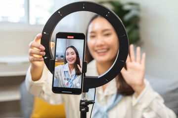 Influencer live internet, happy vlog asian young woman blogger using smart phone talking on video...