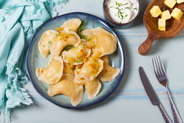 Dumplings with mashed potatoes filling. Varenyky, vareniki, pierogi, pyrohy - dumplings with...