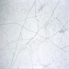 A smooth, white marble surface featuring subtle gray veining, ideal for elegant interior designs and luxurious applications.