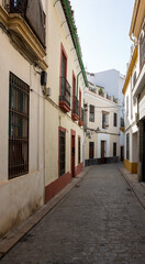 Empty street between houses in Cordoba, Spain.