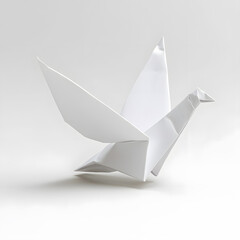 White flying origami bird made of white folded paper, symbolizing peace , isolated on white background