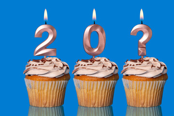 Birthday Cupcakes with Lit Number 20 And Question Mark Candles