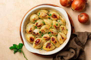 Oven baked Stuffed Onion. Stuffed with rice and meat. Traditional Greek or Turkish dishes, Salantourmasi or Sogan dolmasi. Top view.