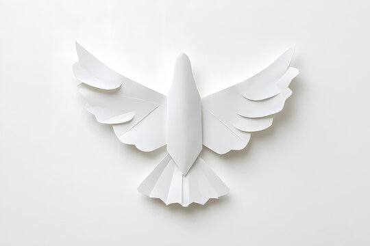 White flying origami bird made of white folded paper, symbolizing peace , isolated on white background