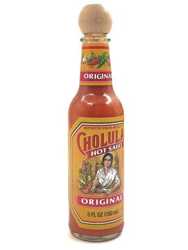 Photo of the Cholula original hot sauce bottle with its signature wooden cap, isolated on white background
