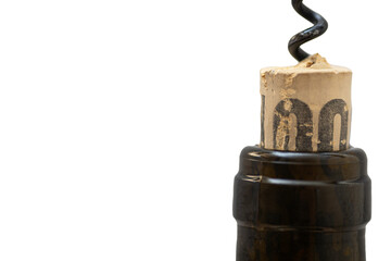 manual corkscrew inserted into a cork stopper in the neck of a wine bottle