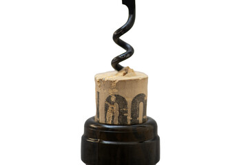 manual corkscrew inserted into a cork stopper in the neck of a wine bottle